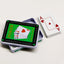 Jocar poker set with double metal box, includes playing cards and chips, ideal for family and party game fun.