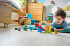 Lego DUPLO Dinosaur Spidey-Rex and Green Goblin playset with colorful LEGO figures and dinosaur figures on a playmat background.