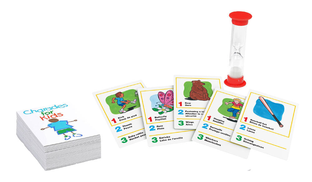 Pressman Charades for Kids game with colorful cards and game pieces arranged on a table for family fun.