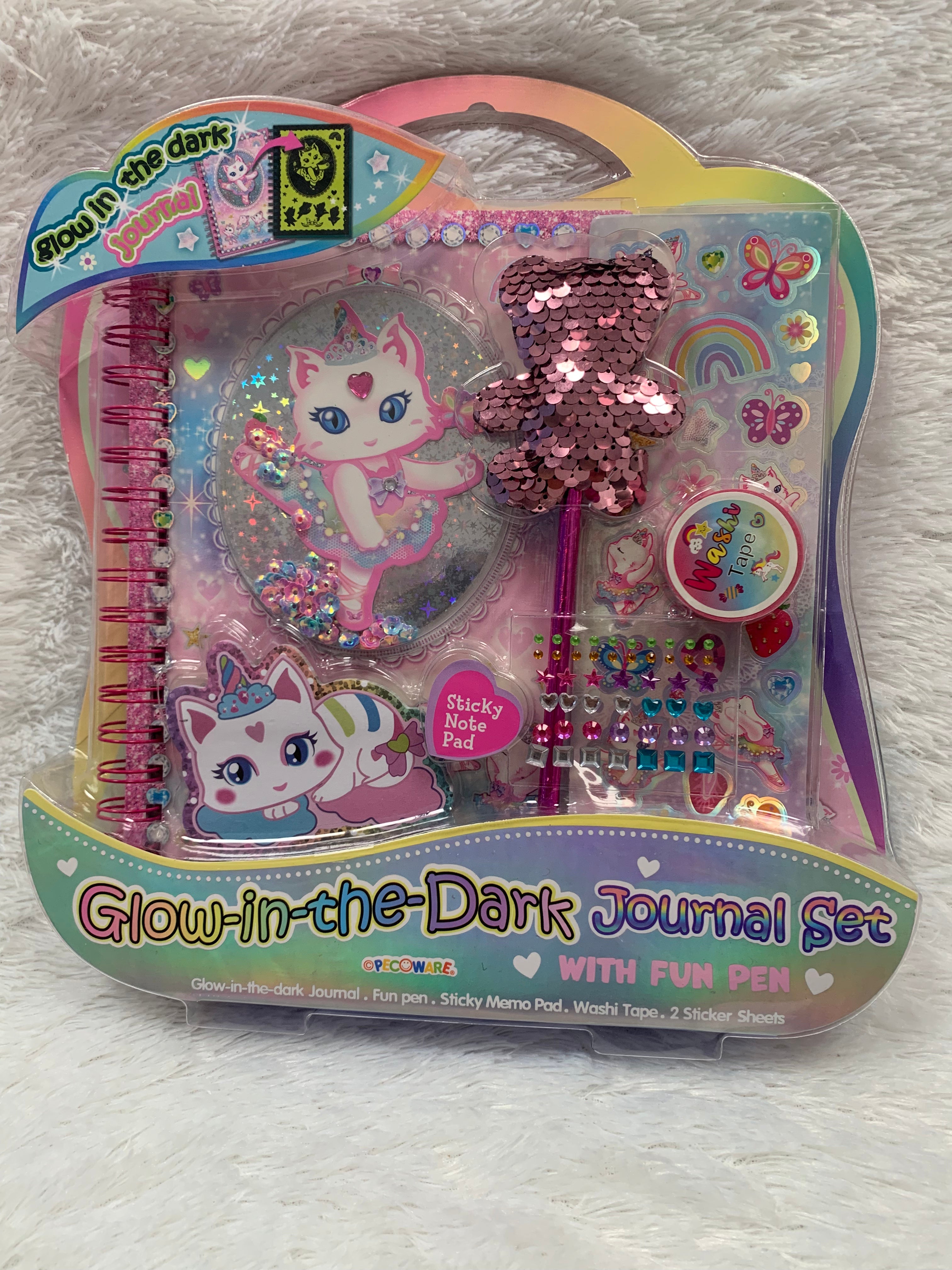 Glow in the dark journal set by PECOWARE featuring a dark cover with glowing design elements and multiple pages inside.