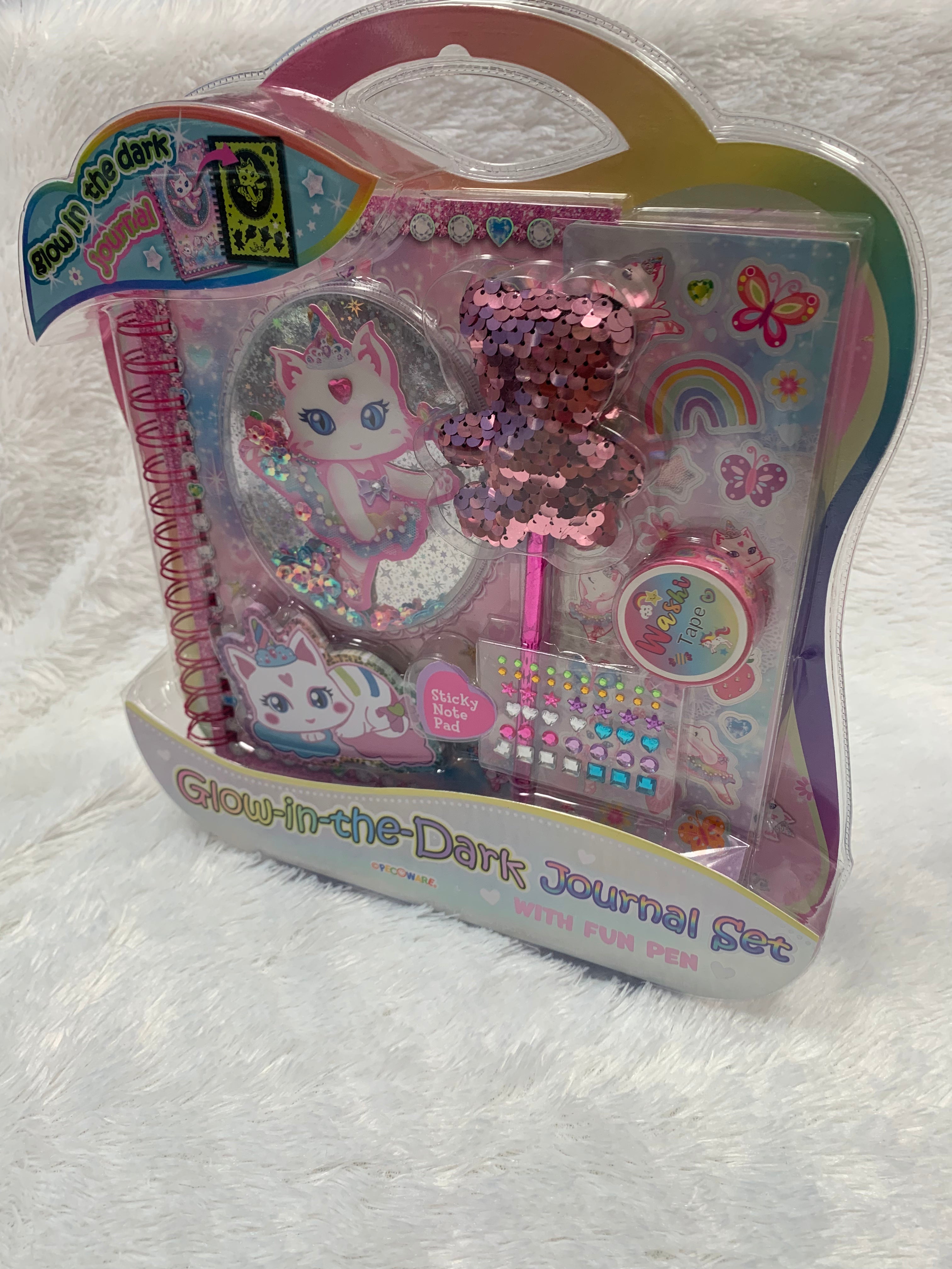 Glow in the dark journal set by PECOWARE featuring multiple notebooks with luminous covers and matching pens.