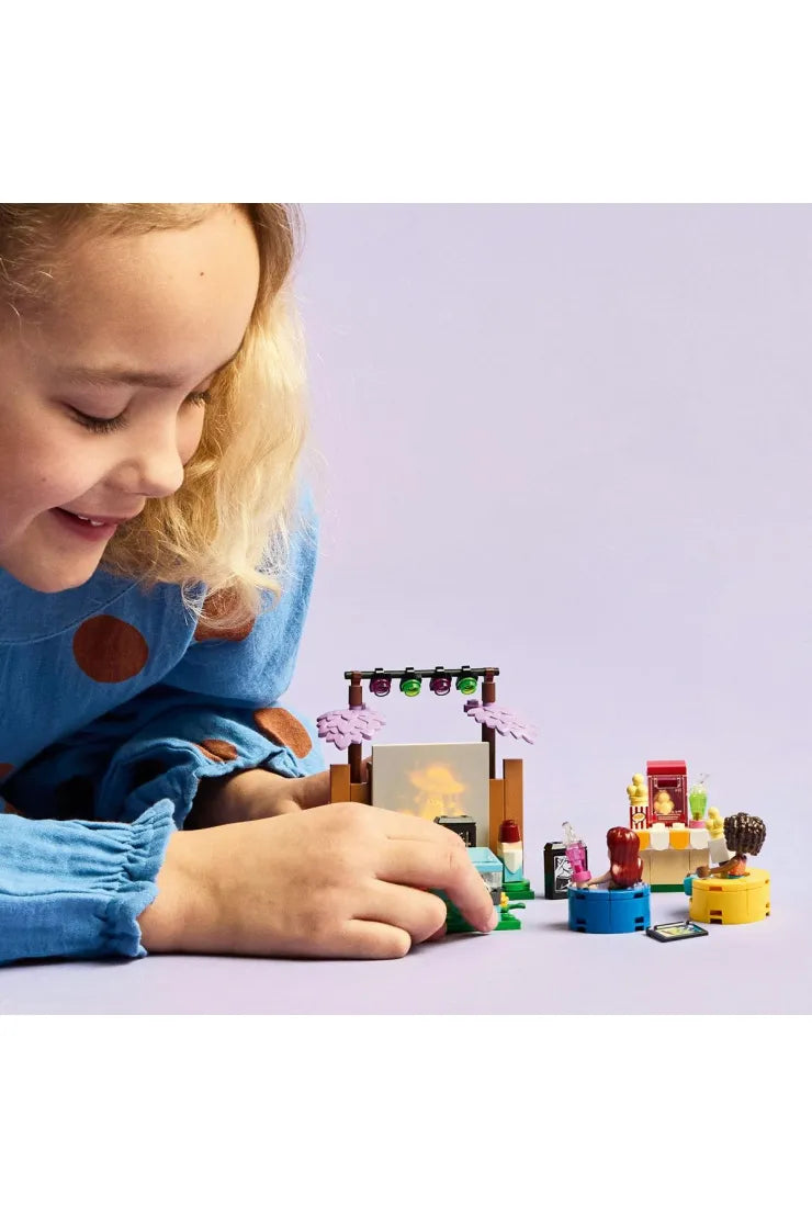 LEGO 42642 Friendship Movie Night set featuring LEGO minifigures and building components for creative play.