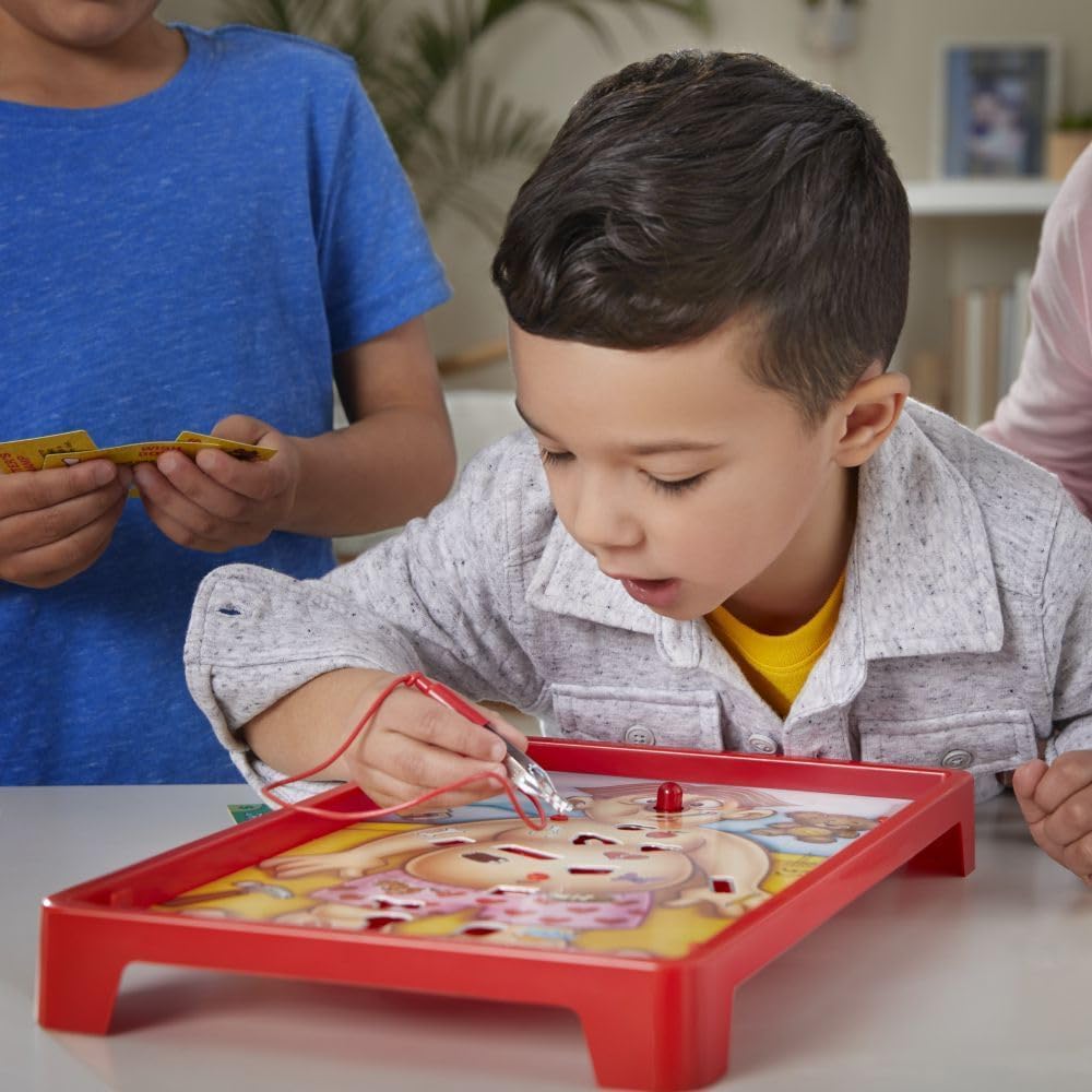 Hasbro Classic Operation game with a wooden game board, plastic patient parts, and a metal tweezers for removing ailments.