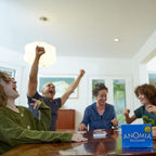 Playzokids Anomia card game for adults, kids, and families, featuring colorful playing cards on a table.