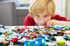 Set of 8 Hot Wheels 1:64 scale basic die-cast cars in various colorful vehicle designs.