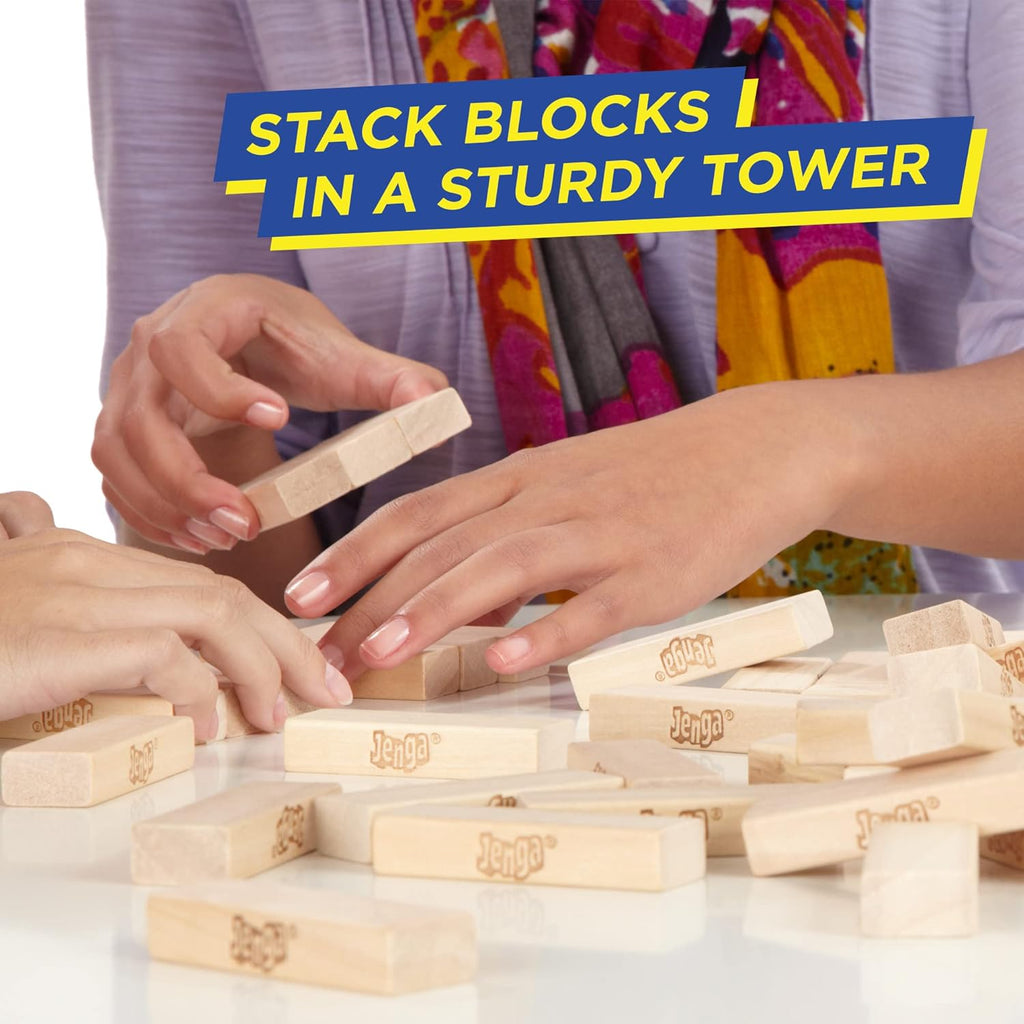 Hasbro Classic Jenga game with wooden blocks stacked in a tower, ready for players to take turns removing and balancing blocks.