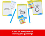 Mattel Pictionary board game with colorful game pieces and drawing cards laid out on a wooden table.