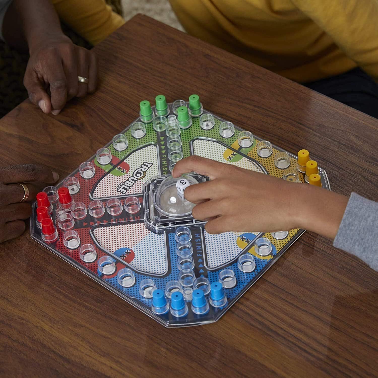 Hasbro Trouble board game with colorful game board, pop-o-matic dice roller, and game pieces for family fun.