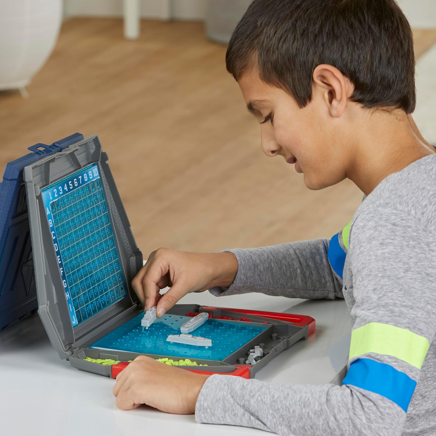 Hasbro Battleship Classic Board Game with ocean-themed game board and ships for strategic gameplay.