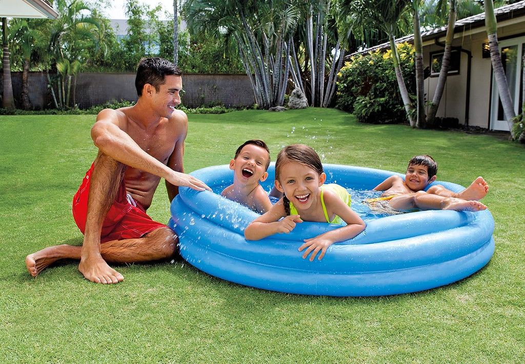 Playzokids Intex Recreation Crystal Blue Pool filled with water and set up outdoors, showcasing a large inflatable swimming pool.