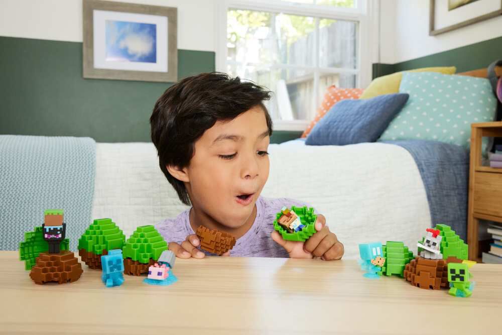 Assorted Minecraft Mini Mode Spawn Eggs by Mattel, featuring colorful toy eggs with game-inspired designs and characters.