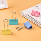 Set of 24 colorful 32 mm Playzokids binder clips with assorted colors, ideal for organizing papers and documents.