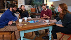 Dixit family board game by Playzokids, featuring illustrated cards and game components on a table for imaginative gameplay.