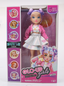 Playzokids Far Out Toys GLO-UP Girls Sadie doll with colorful outfit and styled hair, standing against a vibrant background.