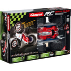 Carrera R/C Turnator 1:16 remote control toy car on a smooth surface, showcasing its sleek design and vibrant colors.