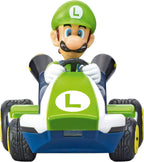 Carrera RC Mario Kart tabletop racing set with Mario and Luigi figures, featuring colorful race track and remote-controlled cars.