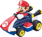 Carrera RC Mario Kart tabletop racing set with Mario and Luigi figures, featuring colorful race tracks and miniature cars.