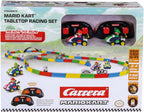 Carrera RC Mario Kart tabletop racing set with Mario and Luigi figures, featuring colorful race tracks and miniature cars.