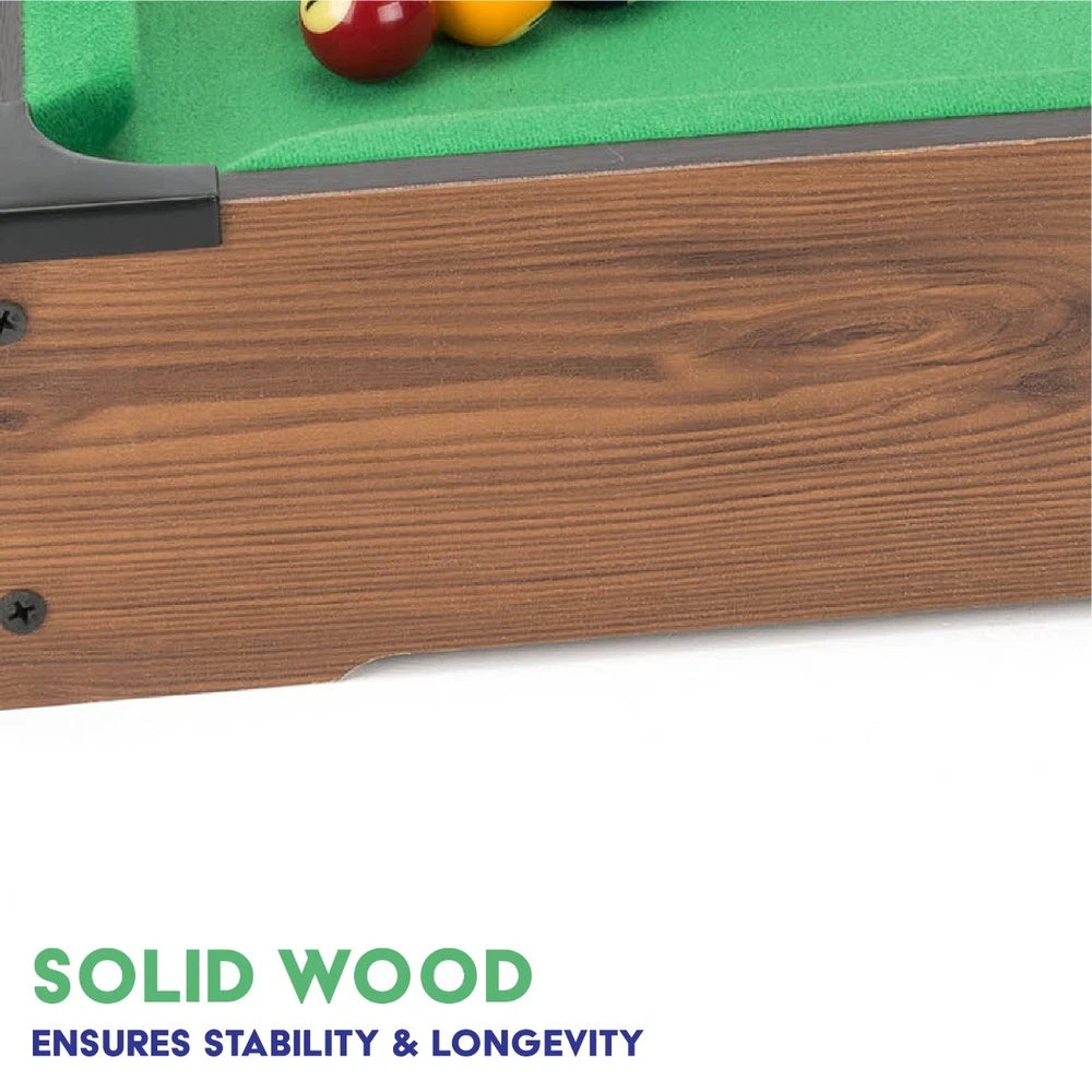Power Play pool table toy with green felt surface, wooden frame, and billiard balls for kids' playroom entertainment.