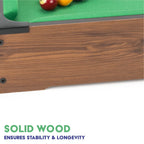 Power Play pool table toy with green felt surface, wooden frame, and billiard balls for kids' playroom entertainment.