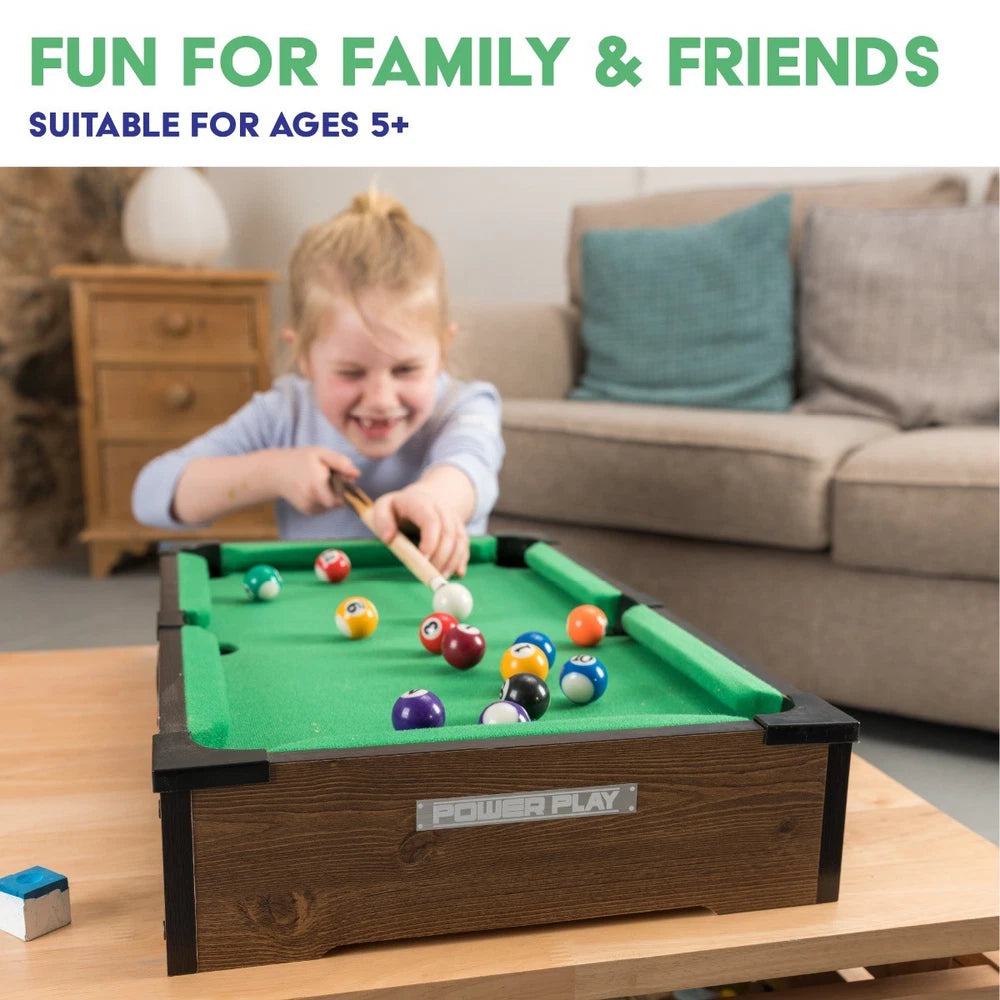 Power Play pool table toy with green felt surface, wooden frame, and billiard balls for kids' game room entertainment.