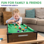 Power Play pool table toy with green felt surface, wooden frame, and billiard balls for kids' game room entertainment.